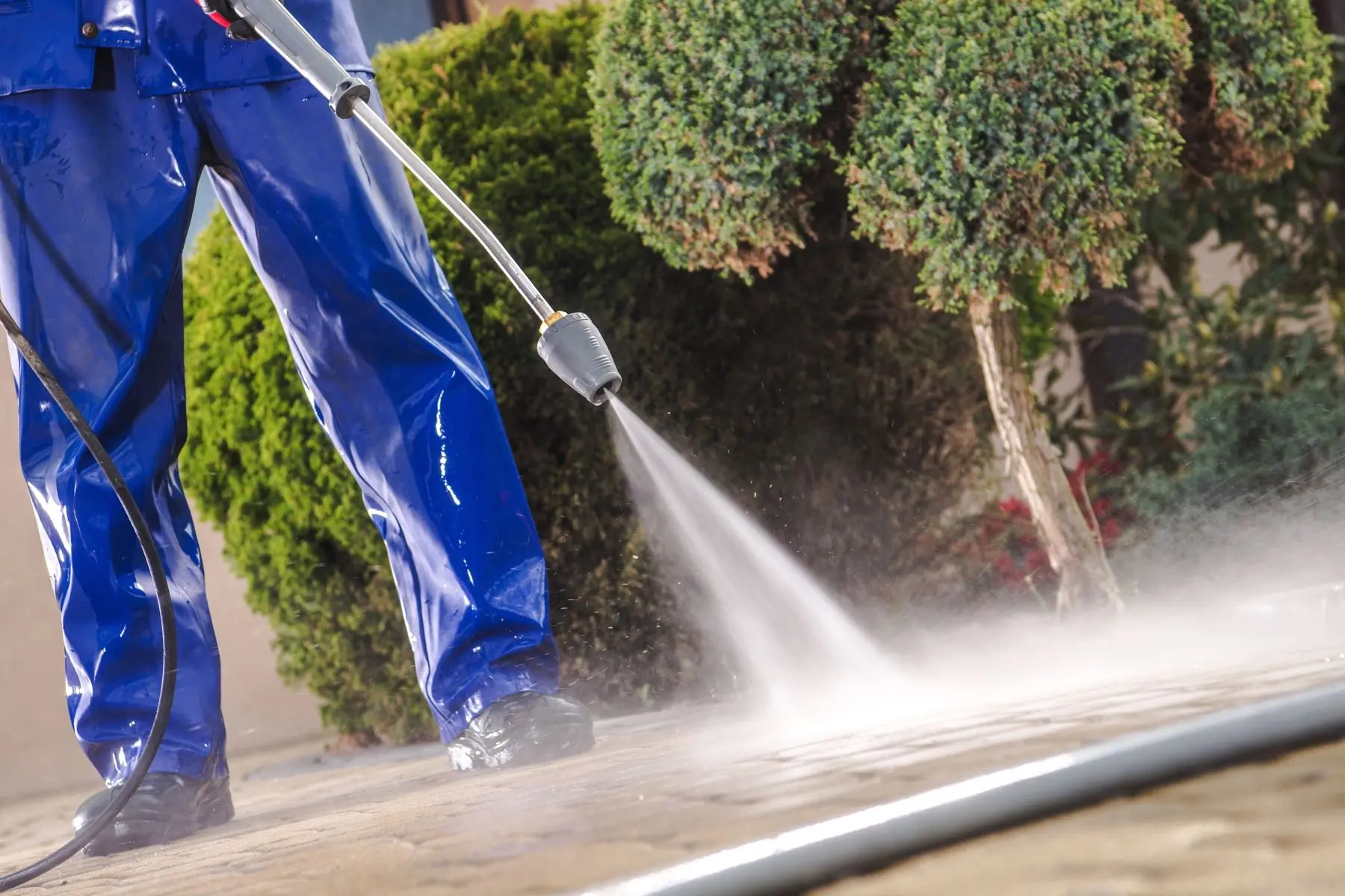 Before pressure washing: stained, dirty concrete driveway in Ventura County
